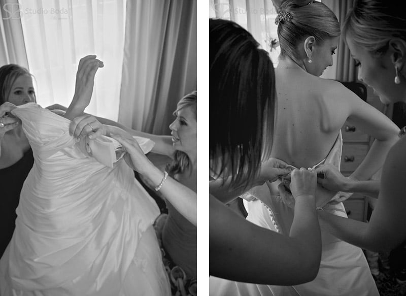 La novia poniendo el vestido de boda